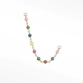 Ear chain handcrafted by nina wynn. The rock candy collection features a vibrant rainbow of natural faceted multi