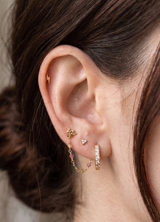 Ear chain handcrafted by nina wynn. The rock candy collection features a vibrant rainbow of natural faceted multi