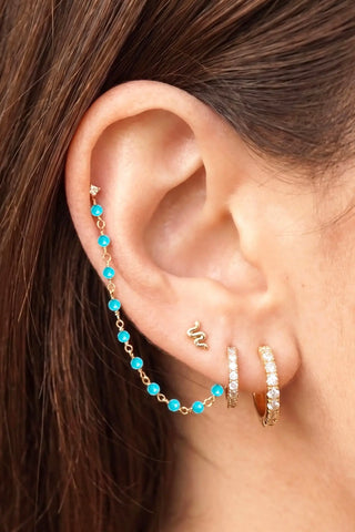 Ear chain by nina wynn. The prismatic emerald collection showcases vivid regal green precious stones in 14k yellow