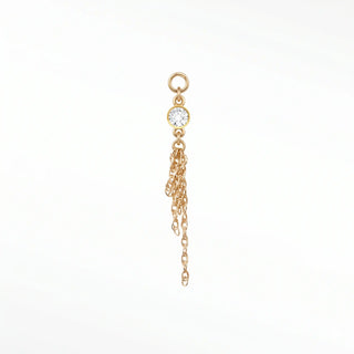 Ear charm crafted in solid 14k gold featuring a 3mm round bezel-set diamond and dangling multi-strand rope chain.
