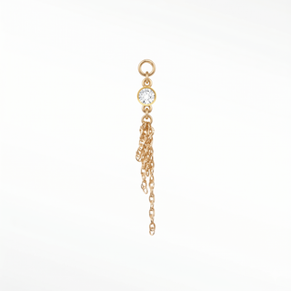 Ear charm crafted in solid 14k gold featuring a 3mm round bezel-set diamond and dangling multi-strand rope chain.