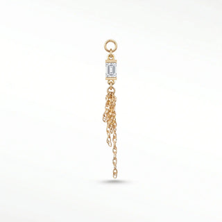 Ear charm in 14k gold featuring a fiery moissanite baguette & liquid chains. Engineered loop fits hoops studs and flat