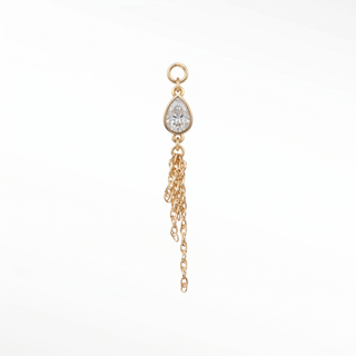 Ear charm crafted in solid 14k gold featuring a 6x4mm pear bezel-set moissanite and dangling multi-strand rope chain.