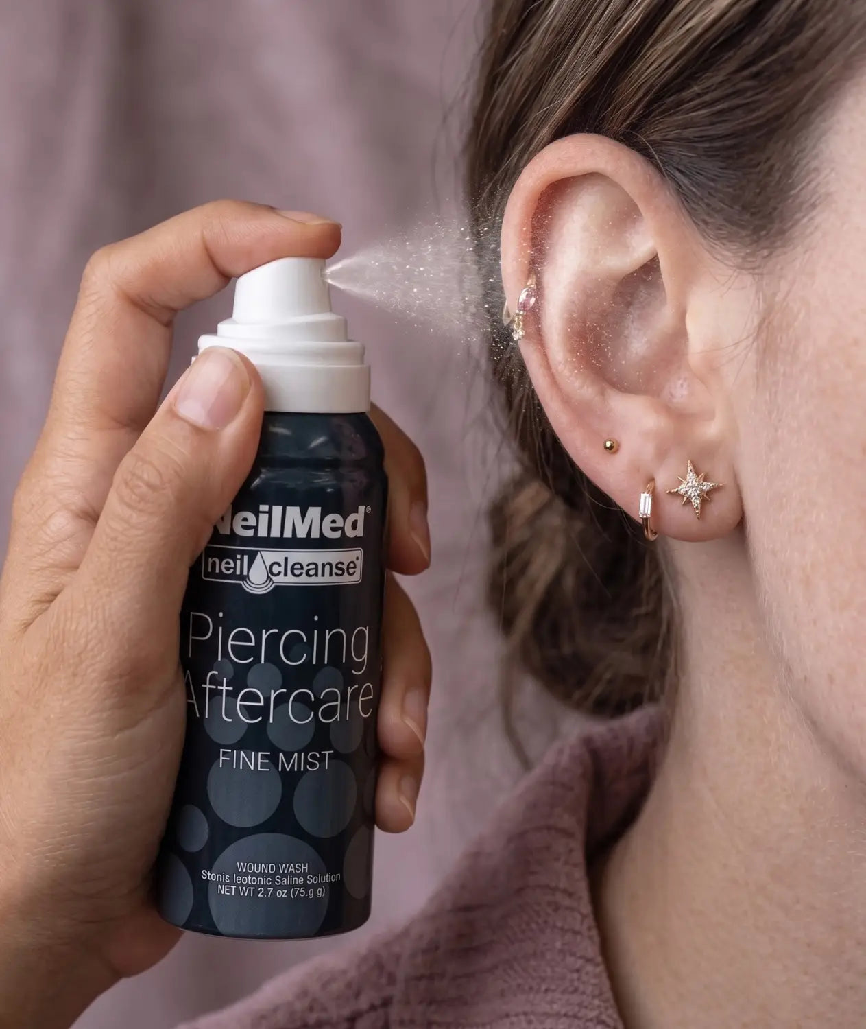 Ear piercing aftercare using sterile saline wound wash