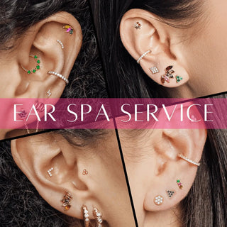 A collection of colorful gemstone-encrusted gold and silver ear piercings by jewelry designer nina wynn at ear spa denver
