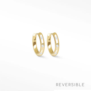 Ellie diamond 14k yellow gold reversible huggies 13mm gold hoop earrings with three clear round-cut stones on outer curve