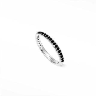 A sleek sterling silver eternity band featuring a continuous line of black spinel stones thea black spinel ring
