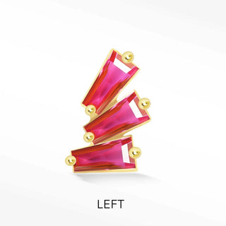 A vibrant fuchsia rectangular gemstone ring with gold-tone settings and spherical accents complementing flat backed earrings