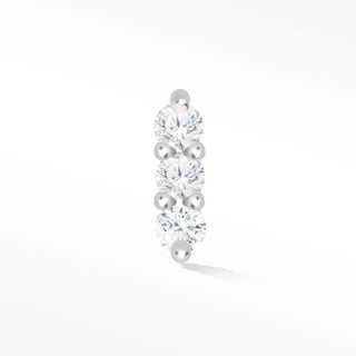 A sleek 14k white flat back cartilage earring with three round-cut stones and spherical accents from wynning studs
