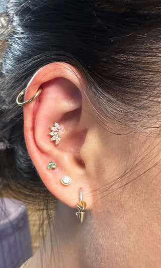 Flat back piercing jewelry used for comfort and healing on a Denver client