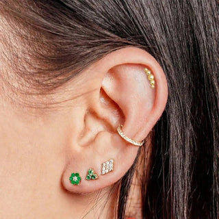 Gold-toned 14k yellow croissant ear cuff with small round beads along its curved edge in flat back earrings stud design