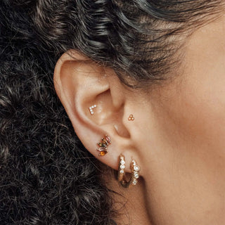 Rose gold flat back gold earrings with clear crystals and a small colorful gemstone accent from The Wynning Studs