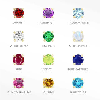 A collection of twelve colorful flatback gemstones set in 14k yellow gold prongs from the Wynning Studs