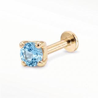 Blue Topaz flat back stud in 14K Yellow Gold with a titanium labret