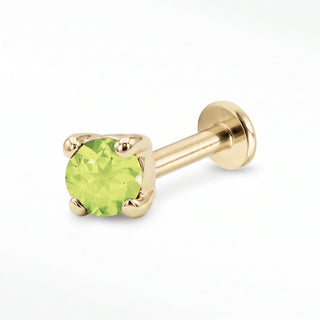 Peridot flat back stud in 14K Yellow Gold with a titanium labret