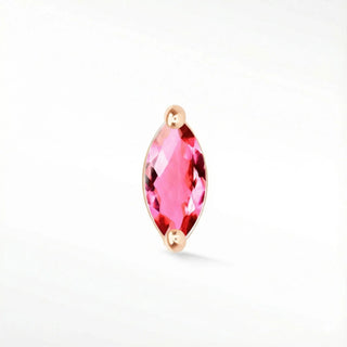 A vibrant flatback pink sapphire marquise-cut gemstone earring set in 14k rose gold bezel from wynning studs