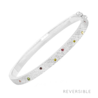 Silver florentine multi tourmaline bangle with textured surface and colorful embedded gemstones in multi tourmaline silver design