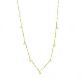 A forged diamond gold 14k necklace featuring a delicate gold chain with evenly spaced sparkling round diamonds