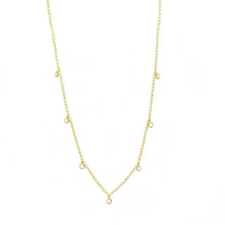 A forged diamond gold 14k necklace featuring a delicate gold chain with evenly spaced sparkling round diamonds