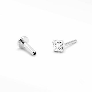 White Topaz threadless top and titanium labret shown separately