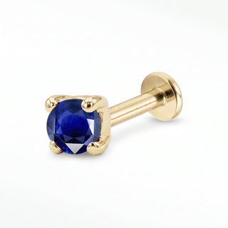 Blue Sapphire flat back stud in 14K Yellow Gold with a titanium labret