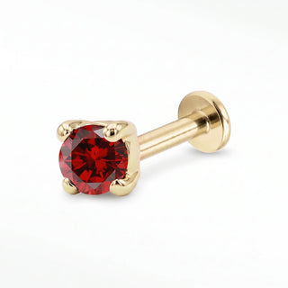 Garnet flat back stud in 14K Yellow Gold with a titanium labret