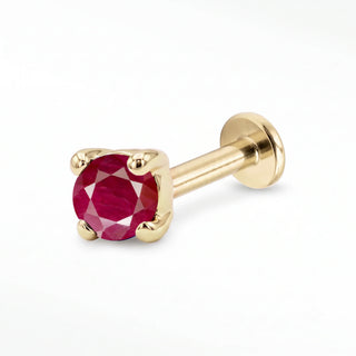 Ruby flat back stud in 14K Yellow Gold with a titanium labret