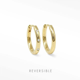 Ellie 13mm 14K yellow gold hoops comparing a spaced lab-grown diamond front with a plain polished gold reverse.