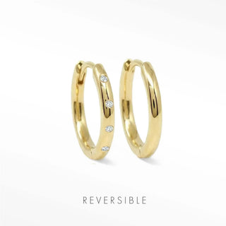 Ellie 22mm 14K yellow gold hoops comparing a spaced lab-grown diamond front with a plain polished gold reverse.