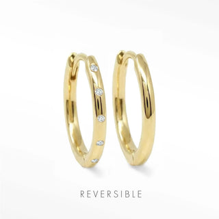 Sleek gold hoop earrings highlighting polished curve