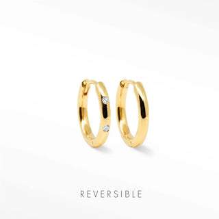 Ellie gold hoop earrings by Wynning reversible hoops feature gold hoops with two small clear gemstones on each side