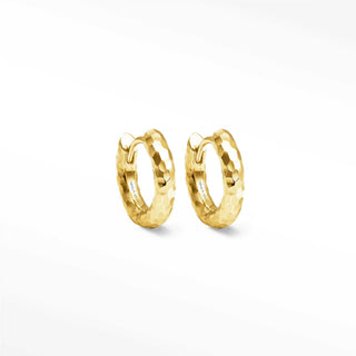 Gold-tone hammered hoop earrings with a textured faceted surface in gold hoop design