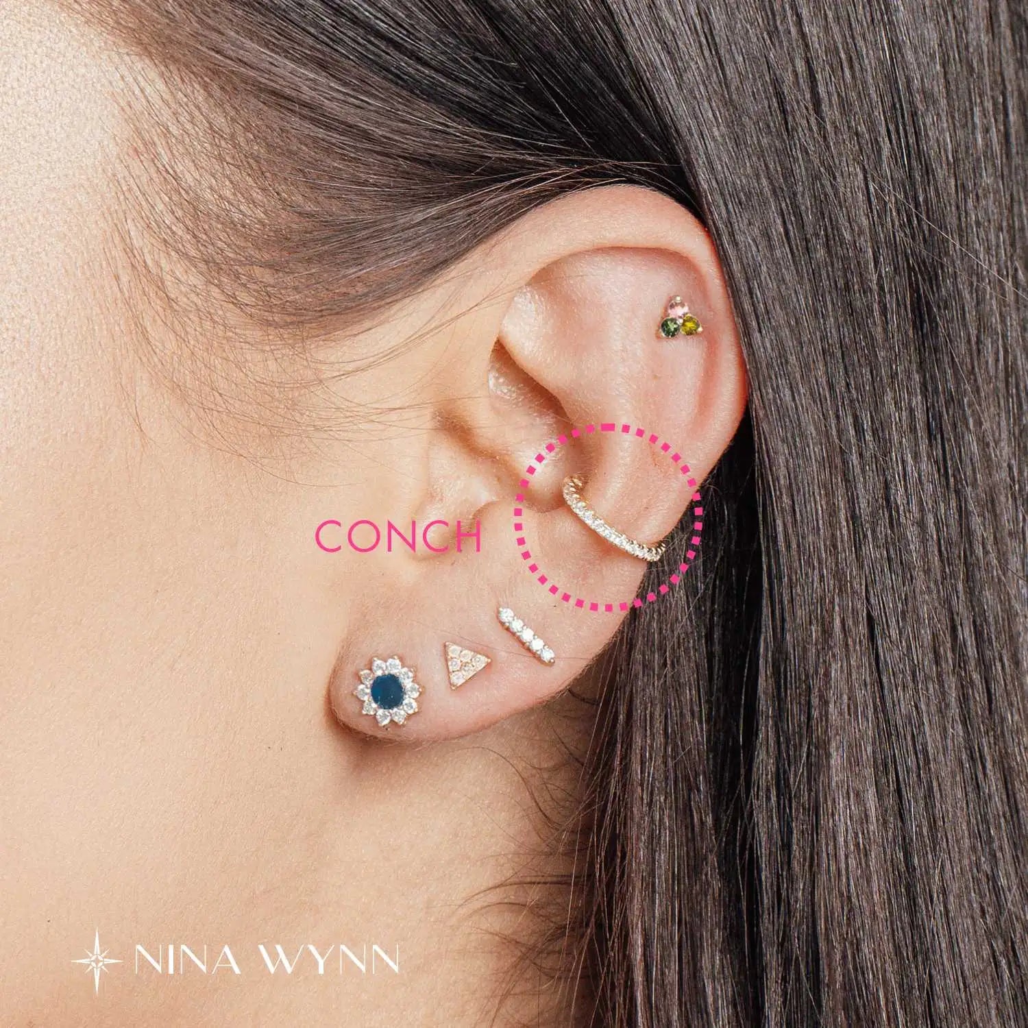 Inner conch piercing placement in the center part of the ear cartilage.