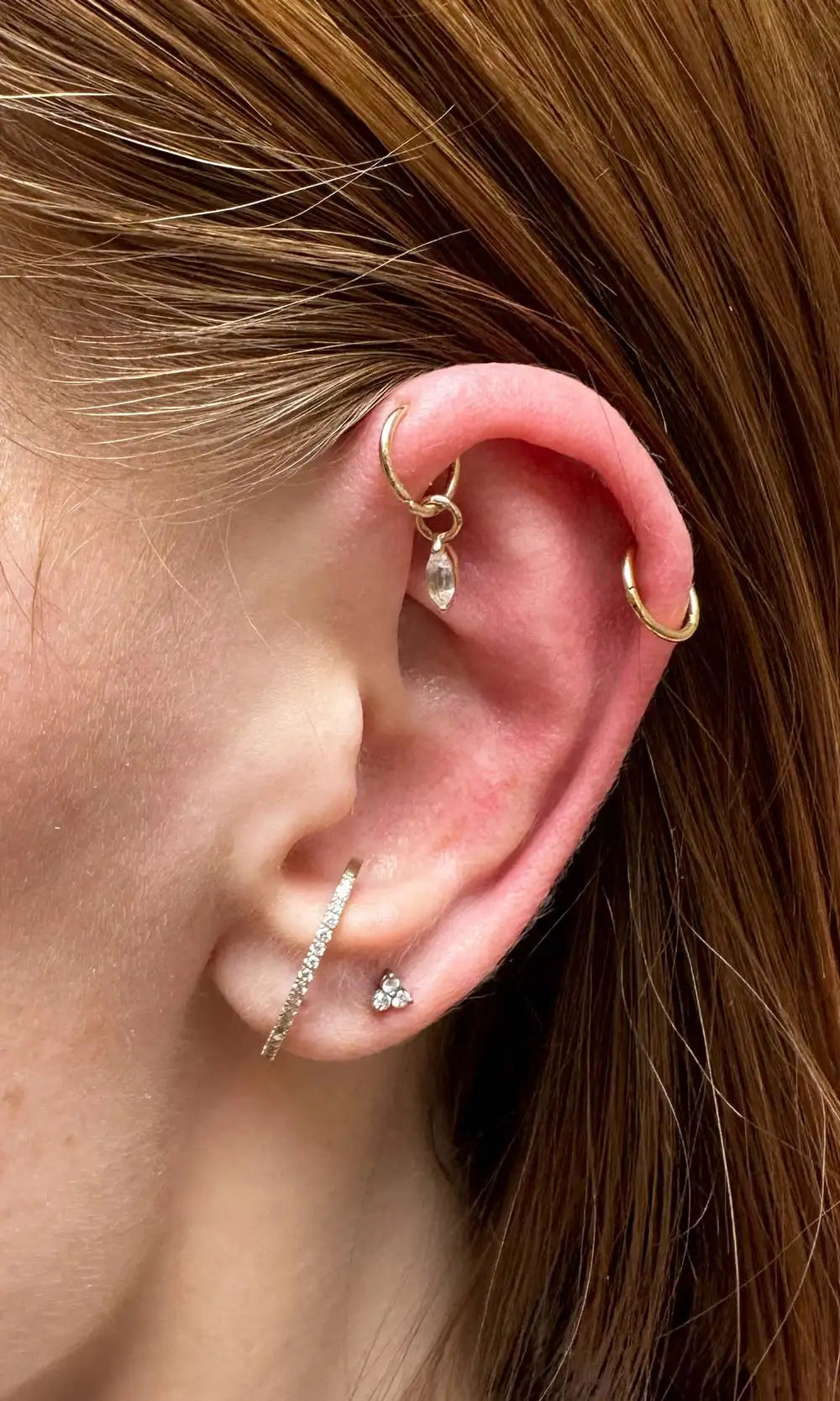 Gold hoop, cuff and crystal piercing jewelry styling