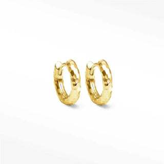 Gold-tone hammered hoop earrings with a textured faceted surface in gold hoop design