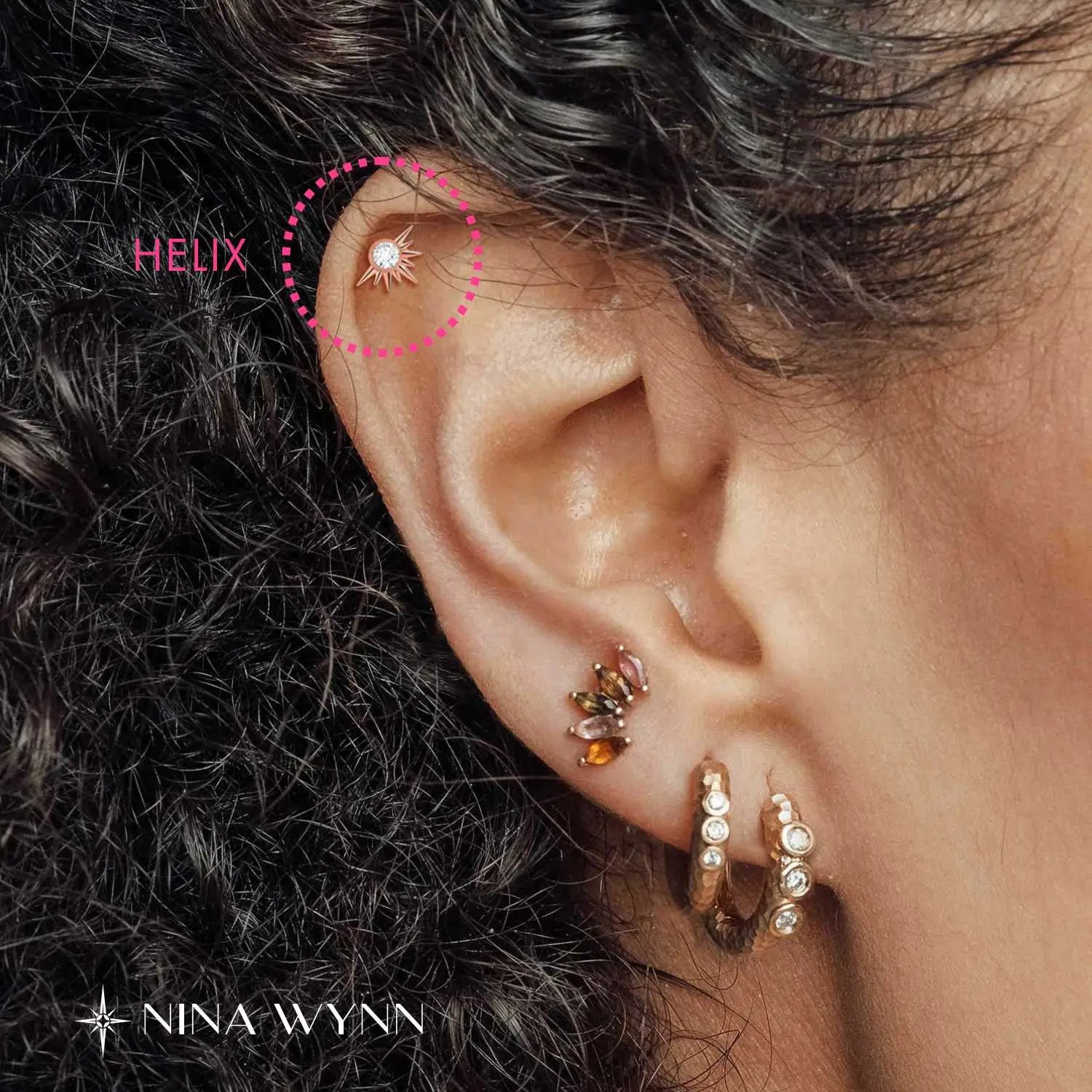 Classic helix piercing location on the outer upper rim of the ear cartilage.