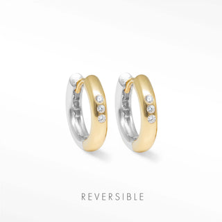 Two tone gold and silver hoop earrings with three clear stones each by Wynning reversible hoops