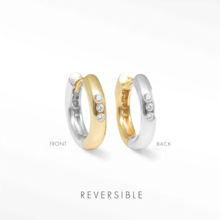 Two tone hoop earrings by Wynning featuring reversible gold and silver finishes with three diamonds on outer edge