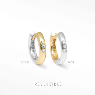 Two tone hoop earrings by Wynning featuring reversible gold and silver finishes with three diamonds on outer edge