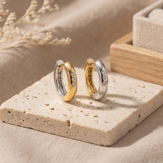 Two-tone reversible hoops showing contrasting white and yellow gold faces