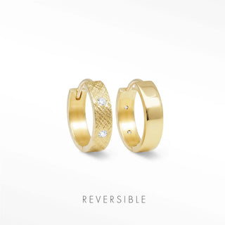 Huggie earrings gold with a textured surface and two clear stones in the center from Wynning reversible hoops collection
