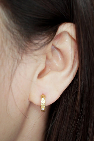Gold-toned huggie earrings gold with textured florentine diamond pattern in 14k gold by wynning reversible hoops