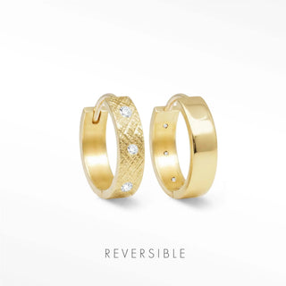 Huggie earrings gold featuring one textured with diamonds and one smooth polished gold reversible hoop by Wynning
