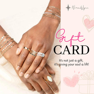 A delicate gold-toned ring with an oval white stone set in an elegant band ideal for a jewelry gift card gift