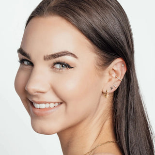 Gold-toned 14k yellow gold ear cuff by Nina Wynn with a delicate geometric design for jewelry shopping appointment