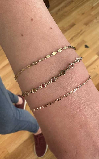 Minimal layered forever bracelets welded for a subtle infinity-style stack in Denver.