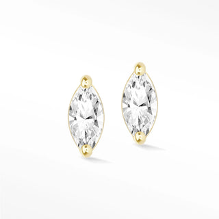 Elegant marquise diamond stud earrings in 14k gold featuring clear marquise-cut gemstones held by gold beads