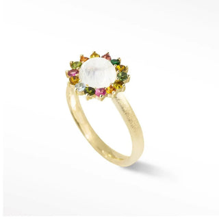 A maya moonstone gold 14k ring with a white moonstone center and colorful tourmaline halo by Nina Wynn