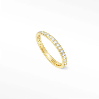 Delicate moonstone eternity band Thea with a 14k gold band featuring a continuous line of sparkling diamonds
