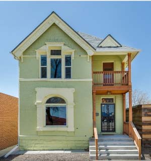 Exterior of Nina Wynn luxury piercing studio in a historic Victorian house in Jefferson Park, Denver. 